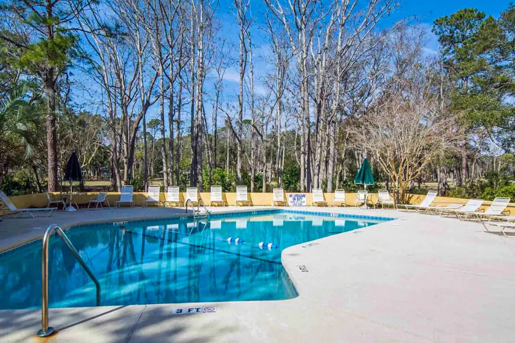 Family-friendly condo near the beach with balcony, central AC, & shared pool