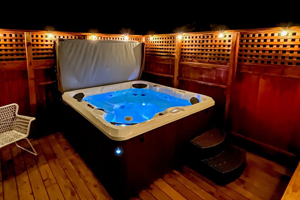 Dreamy home with expansive patio & alfresco dining, private hot tub, yard & W/D