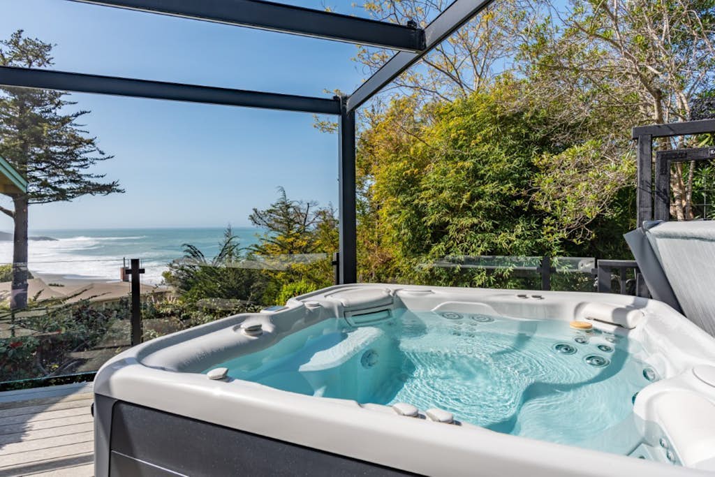 Updated home with ocean views, private hot tub, fire table, outdoor kitchen