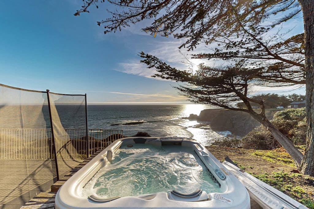 Blufftop home with hot tub & forever oceanfront views & private cottage