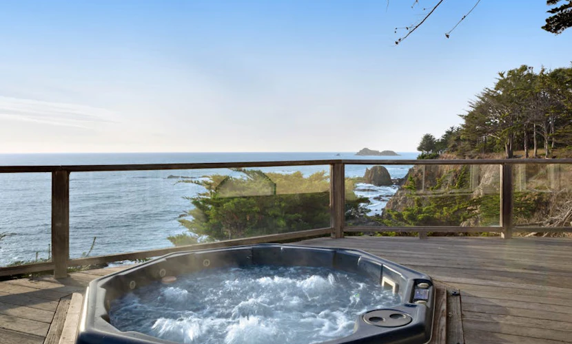 Oceanfront home with private hot tub, views, & close beach access