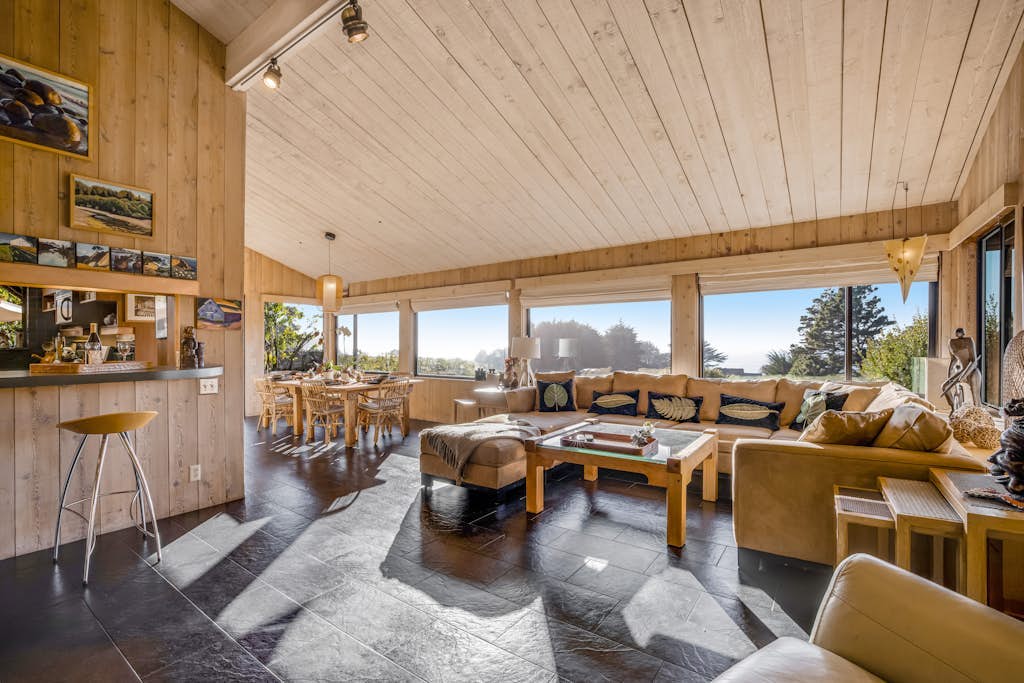 Wake to ocean views and the call of seabirds in this light-filled coastal home. End the day in your private hot tub with the ocean as your soundtrack. Bring your pup -- dogs love the bluff trails here. Room for 6 in this 3-bedroom home. Sea Ranch community pools, tennis courts, and the Lodge are nearby. Architecture, nature, and the Pacific -- Sea Ranch has it all. Step outside and the Pacific stretches before you -- this is the Sonoma Coast at its most dramatic.