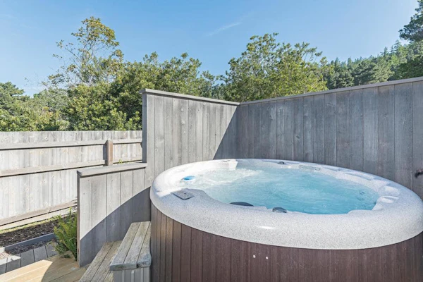 Fog, sun, and sea -- the ever-changing coastal light makes every morning feel new. End the day in your private hot tub with the ocean as your soundtrack. Curl up by the fireplace as fog rolls in off the Pacific. Room for 4 in this 2-bedroom home. Sea Ranch community pools, tennis courts, and the Lodge are nearby. Architecture, nature, and the Pacific -- Sea Ranch has it all. The bluff trail starts steps from the door, winding along the cliffs above crashing whitecaps.