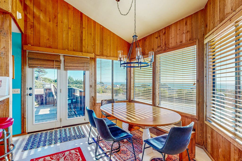 The Pacific horizon is the backdrop to every morning here -- coffee tastes better with a view. Bring your pup -- dogs love the bluff trails here. Step outside to a deck overlooking the ocean. Room for 6 in this 2-bedroom home. A short walk from Black Point trails. Your front door opens to Sea Ranch's 50 miles of trails and the wild Sonoma Coast. The light here shifts by the hour -- silver mornings, gold afternoons, pink-and-orange sunsets.