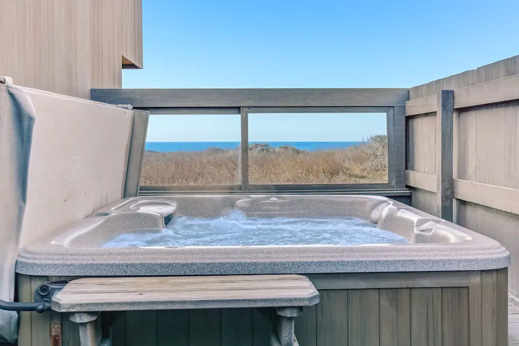 Dog-friendly home with cove views, a private hot tub, & rec center access