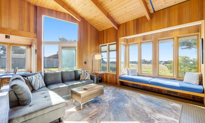 Your deck doubles as a whale-watching station during migration season at this ocean-view retreat. Soak in the hot tub as the sun dips below the Pacific. Bring your pup -- dogs love the bluff trails here. Room for 8 in this 3-bedroom home. Sea Ranch community pools, tennis courts, and the Lodge are nearby. Whale watching, sunset hikes, and starlit skies -- the coast is calling. The light here shifts by the hour -- silver mornings, gold afternoons, pink-and-orange sunsets.