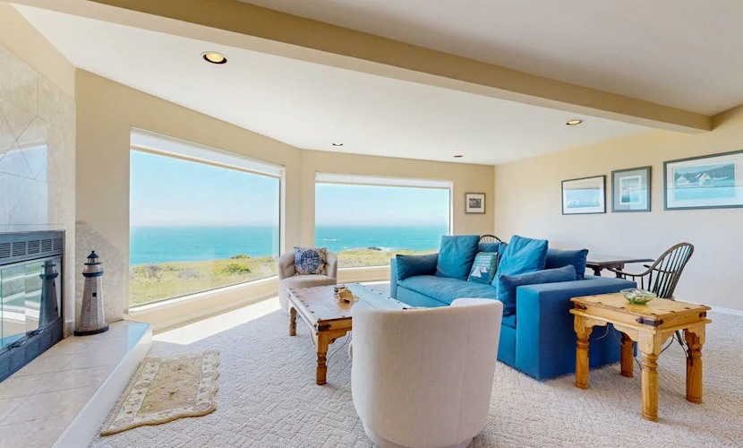 Open the door to panoramic Pacific views and endless coastal sunsets. Soak in the hot tub as the sun dips below the Pacific. Step outside to a deck overlooking the ocean. Room for 6 in this 3-bedroom home. Just a 7-minute walk to the heated community pool. Leave the city behind -- the only agenda here is yours. Salt air drifts through the windows as the Pacific puts on its daily show just beyond the deck. December through April, gray whales migrate along the coast -- binoculars recommended.