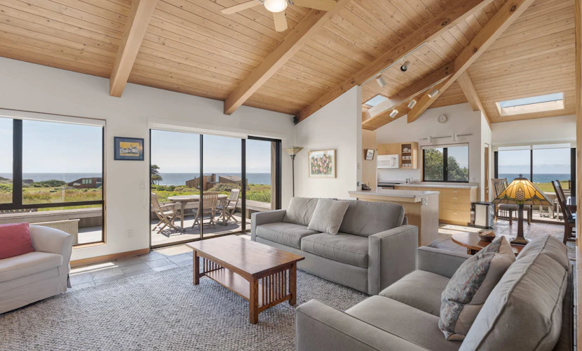 This Sea Ranch home frames the Pacific like a painting -- and the view changes by the hour. Soak in the hot tub as the sun dips below the Pacific. Curl up by the fireplace as fog rolls in off the Pacific. Room for 6 in this 2-bedroom home. Sea Ranch community pools, tennis courts, and the Lodge are nearby. Your front door opens to Sea Ranch's 50 miles of trails and the wild Sonoma Coast. Nothing resets your pace like watching the tide come and go from your own living room.