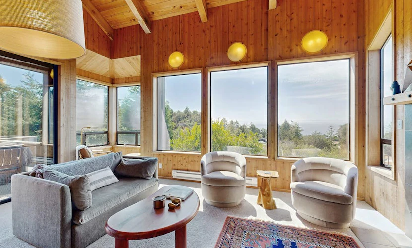 Sunsets paint the sky in oranges and pinks from this ocean-view Sea Ranch home. End the day in your private hot tub with the ocean as your soundtrack. Curl up by the fireplace as fog rolls in off the Pacific. Room for 6 in this 2-bedroom home. Sea Ranch community pools, tennis courts, and the Lodge are nearby. Your front door opens to Sea Ranch's 50 miles of trails and the wild Sonoma Coast.
