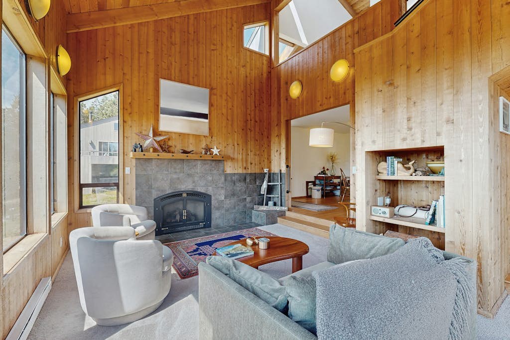 Sunsets paint the sky in oranges and pinks from this ocean-view Sea Ranch home. End the day in your private hot tub with the ocean as your soundtrack. Curl up by the fireplace as fog rolls in off the Pacific. Room for 6 in this 2-bedroom home. Sea Ranch community pools, tennis courts, and the Lodge are nearby. Your front door opens to Sea Ranch's 50 miles of trails and the wild Sonoma Coast.