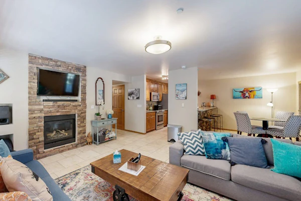 Sophisticated St. Moritz Condo with fireplace, expansive patio & mountain views