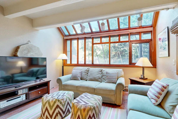 Designer Forest-View Condo with Balcony, Wood Stove & Sunroom - Near Slopes