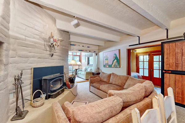 Designer Forest-View Condo with Balcony, Wood Stove & Sunroom - Near Slopes