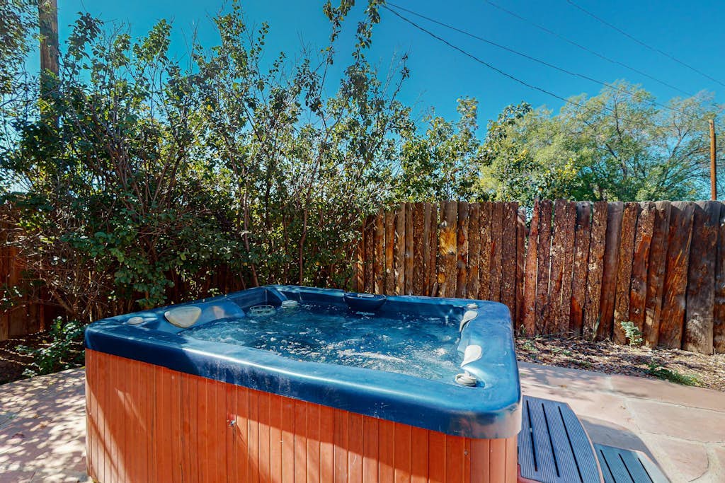 Classic Adobe with hot tub, covered patio & pond near town