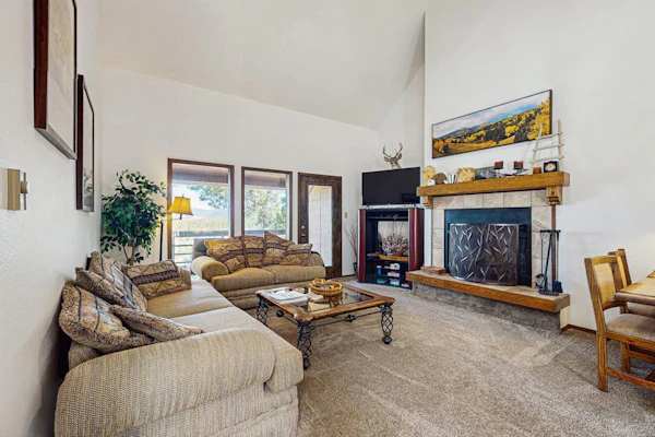 Condo with mountain views, cozy wood burning fireplace, & private gas grill