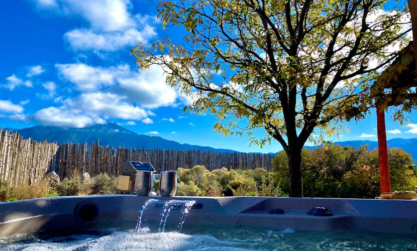 Colorful dog-friendly home with sweeping views, a private hot tub, & large yard