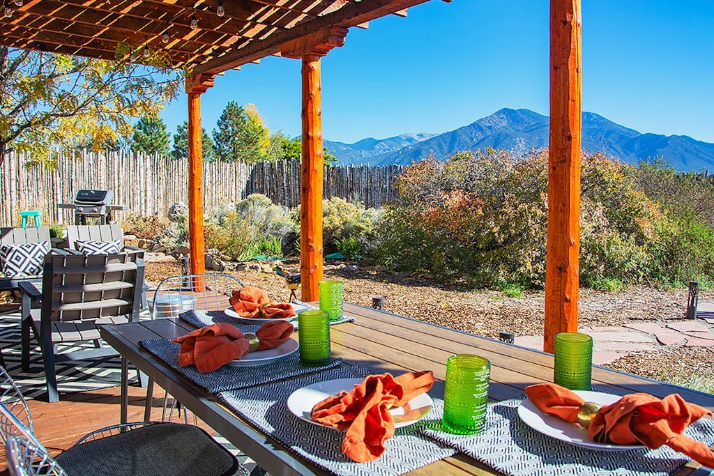 Colorful dog-friendly home with sweeping views, a private hot tub, & large yard