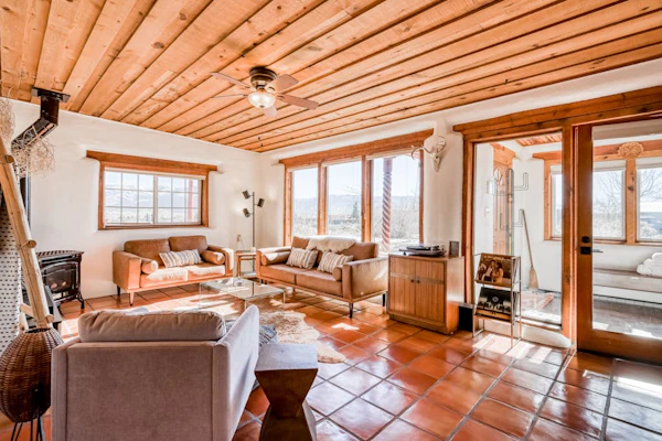 Colorful dog-friendly home with sweeping views, a private hot tub, & large yard