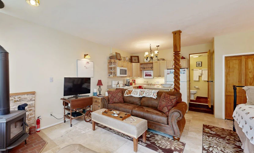 Amazing condo with river & mountain views, hot tub, & wood-burning fireplace