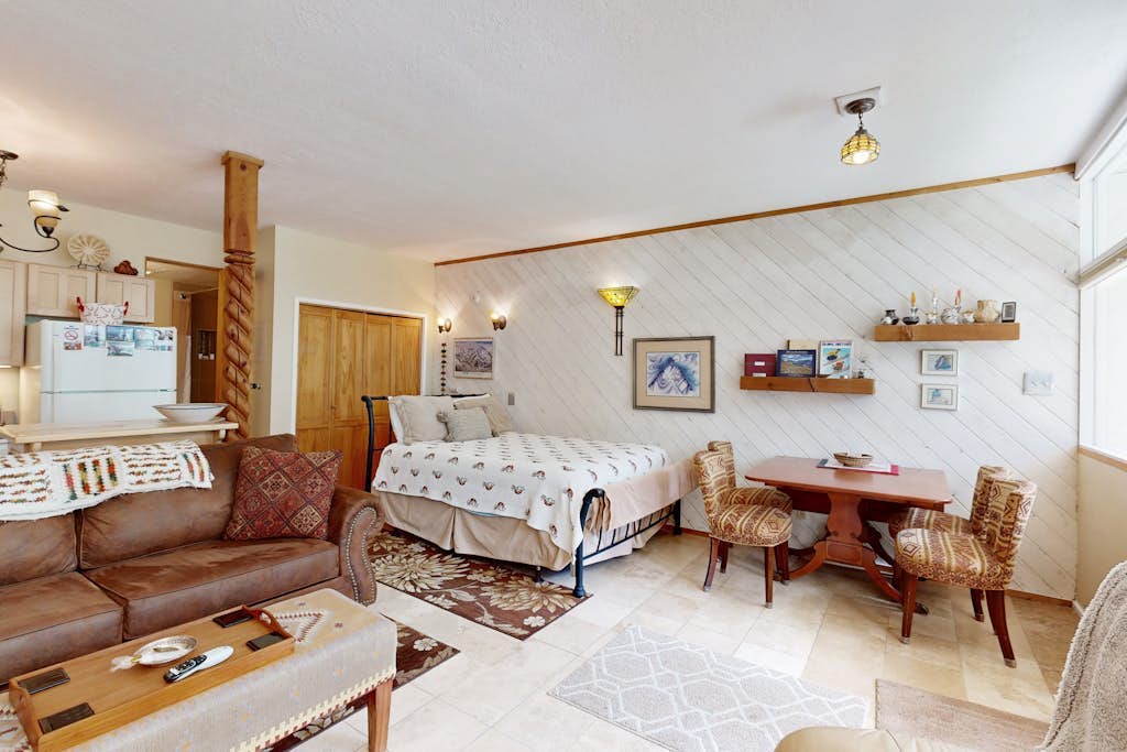 Amazing condo with river & mountain views, hot tub, & wood-burning fireplace