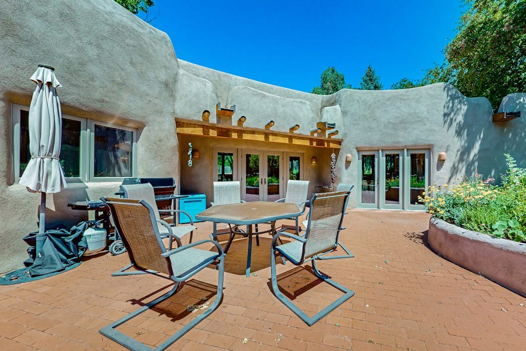 Beautiful adobe home steps the plaza with private patio and garden