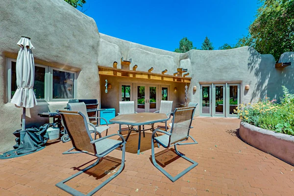 Beautiful adobe home steps the plaza with private patio and garden