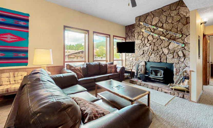 Slope-view condo with deck, stone fireplace, & walk to lifts location