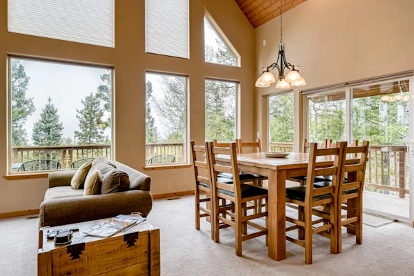 Welcome to Morada Mirasol, your home away from home in beautiful Angel Fire. Surrounded by mountain views, this spacious ski-in/ski-out (seasonal) retreat is designed for families and groups looking to relax, reconnect, and enjoy the outdoors, with a game room, a cozy fireplace, and a wraparound deck for taking in the scenery.