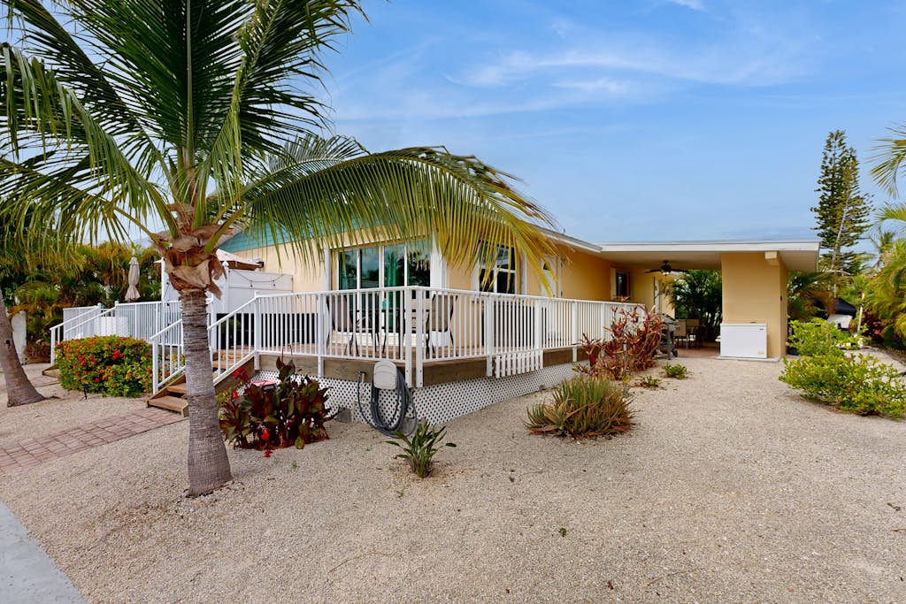 Dog-friendly waterfront home with dock, pool, gas grill, & beach access
