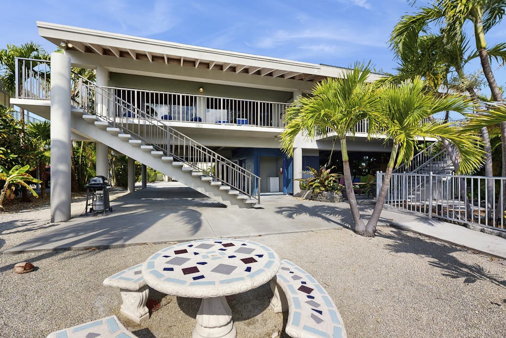 Charming canal-front home with 37-ft dock, kayaks, grill, patio & club access