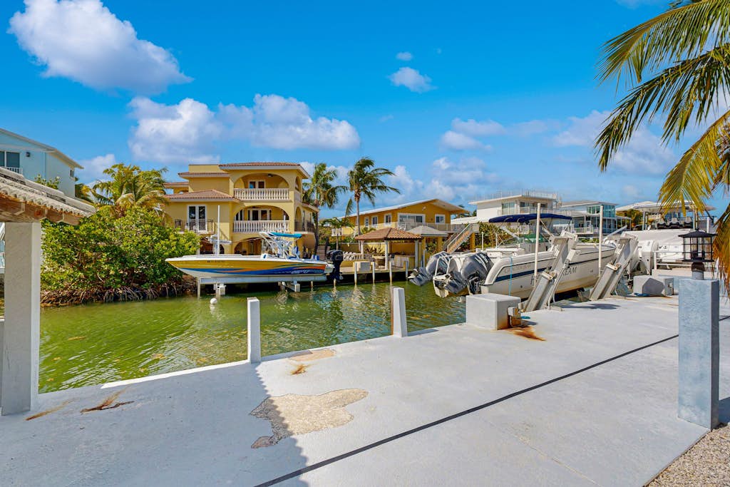 Canal-front, family-friendly home w/ soaking tub, dock access & water view
