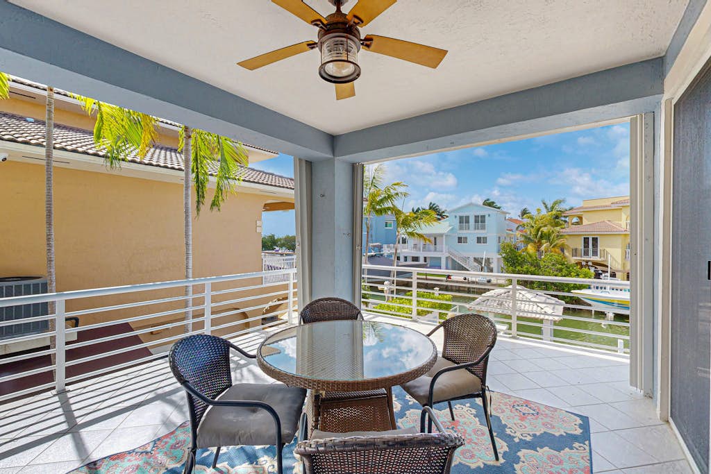 Canal-front, family-friendly home w/ soaking tub, dock access & water view