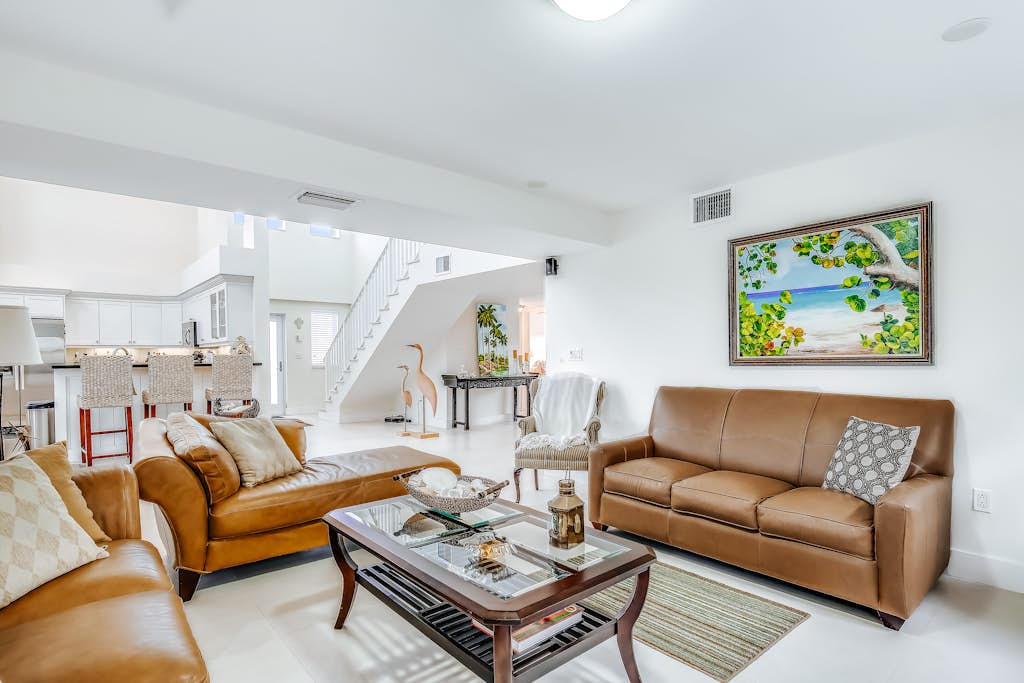 Waterfront home with amazing views, boat dock, screened porch & water sport gear