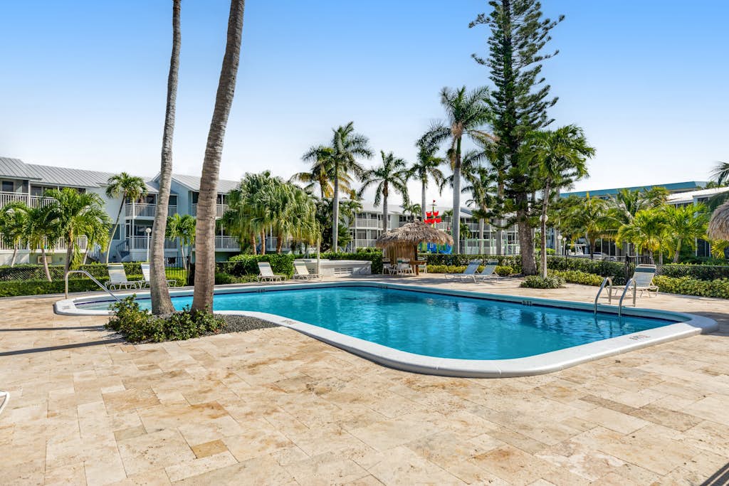Tropical condo with 2 pools, private beach area, swimming lagoon, tennis & AC