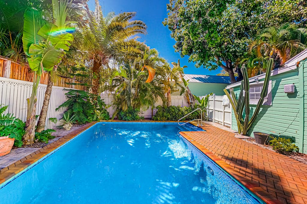 Dog-friendly condo near beach with pool, grill, outdoor shower, W/D, AC