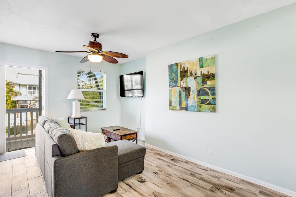 Canalside condo with private dock, boat ramp, water-view patio, central AC & W/D