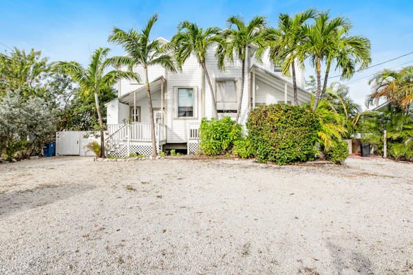 Canalside condo with private dock, boat ramp, water-view patio, central AC & W/D