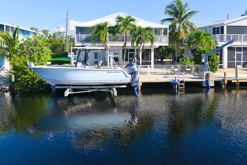 Canal-front home with private dock, hot tub, water views, kayaks, & deck