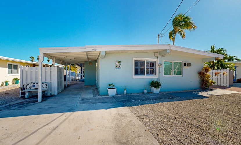 Charming canal-front cottage with private pool, dock and covered lanai