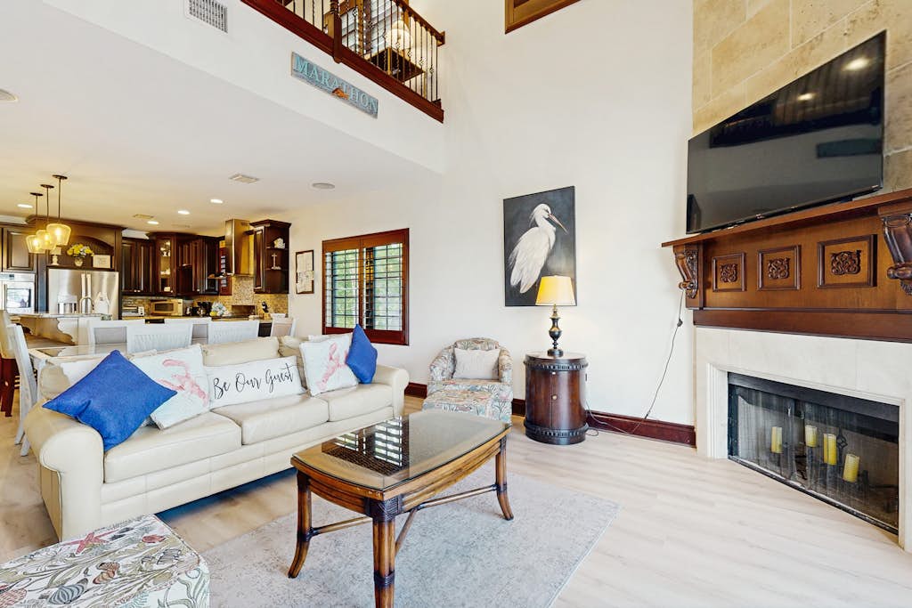 Elegant waterfront home with private pools, hot tub, & dock - walk to beach