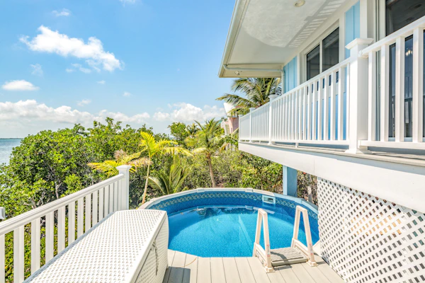 Amazing waterfront home with private beach, dock, pool, WiFi & outdoor kitchen