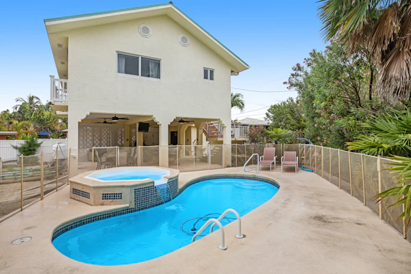 Waterfront hideaway with dock, pool & inviting patio - walk to Sombrero Beach