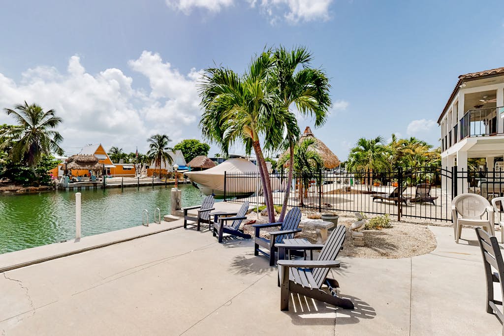 Waterfront home with 60-foot dock & beautiful patio - walk to beach & golf