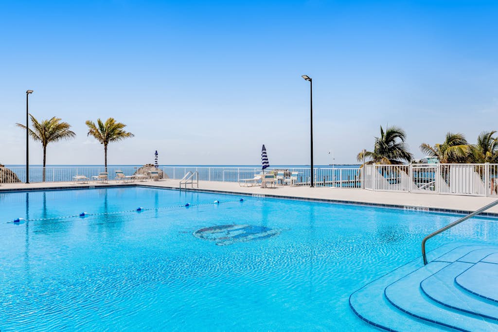 Island retreat with a pool, grill, & beach access - W/D, central AC, & balcony