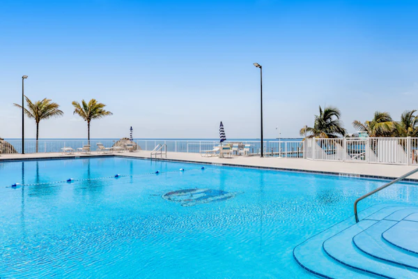 Island retreat with a pool, grill, & beach access - W/D, central AC, & balcony