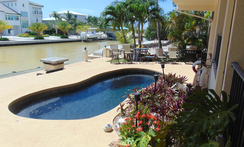 Waterfront home with ocean views, dock, & private outdoor pool