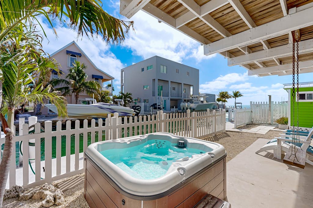 Modern waterfront home with balcony, patio, grill, W/D, & easy Atlantic access