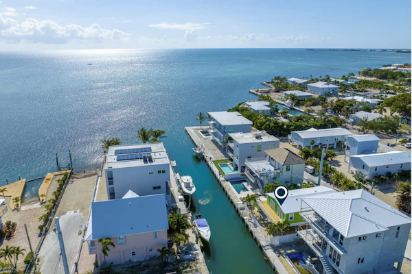 Modern waterfront home with balcony, patio, grill, W/D, & easy Atlantic access
