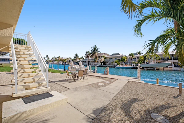 Breezy waterfront home with pool, 35-foot dock & cabana club access