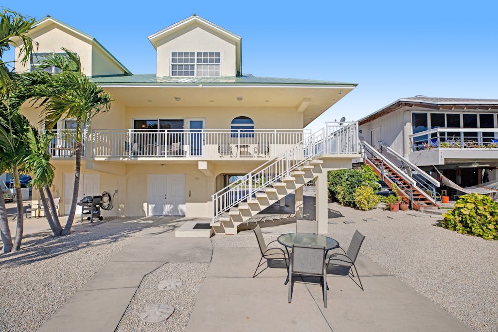 Breezy waterfront home with pool, 35-foot dock & cabana club access